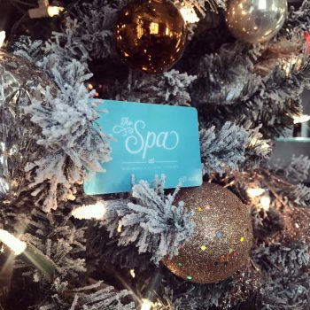 The Spa gift card sitting in Christmas tree